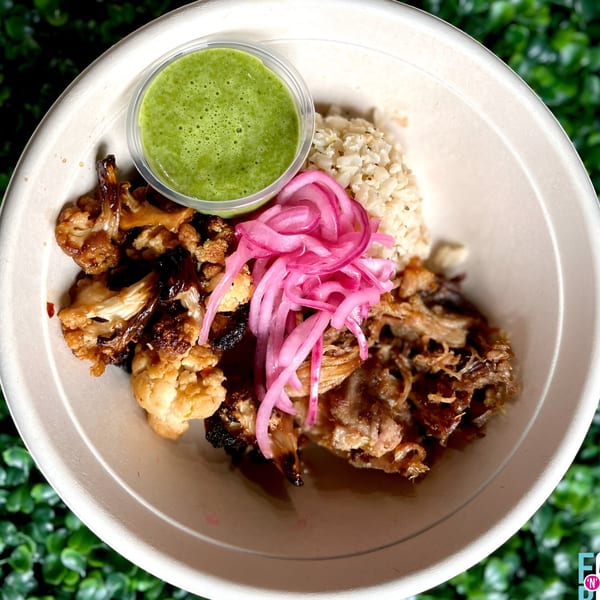 Fork 'N' Bowl's healthy bowl with roasted cauliflower, pulled pork, pickled onions, rice, and green sauce.